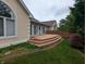 The backyard boasts a lovely wooden deck, perfect for relaxing or entertaining guests at 9640 Bramblewood Way, Carmel, IN 46032