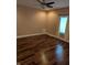 Bedroom with dark hardwood floors, a window with coverings and neutral walls at 9640 Bramblewood Way, Carmel, IN 46032
