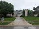 Charming home featuring a three-car garage and meticulously manicured landscaping at 9640 Bramblewood Way, Carmel, IN 46032