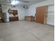 Spacious garage with storage cabinets and work area at 9640 Bramblewood Way, Carmel, IN 46032