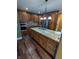 Kitchen featuring granite countertops, stainless steel appliances, and custom cabinetry at 9640 Bramblewood Way, Carmel, IN 46032
