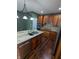 Well-lit kitchen with stainless steel appliances, granite counters, and hardwood floors at 9640 Bramblewood Way, Carmel, IN 46032