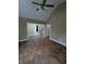 Open living room with terracotta tile flooring and neutral wall color at 9640 Bramblewood Way, Carmel, IN 46032
