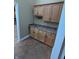 Mud room includes cabinetry, granite countertop, sink, and tile floor at 9640 Bramblewood Way, Carmel, IN 46032