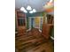 Office featuring hardwood floors, built in shelves, and natural light at 9640 Bramblewood Way, Carmel, IN 46032