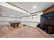Spacious finished basement with poker table and TV area, ideal for recreation and relaxation at 9915 Wellsford Cir, Indianapolis, IN 46236