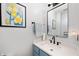 Modern bathroom with stylish mirror, vanity, lighting, and fresh blue accents at 9915 Wellsford Cir, Indianapolis, IN 46236