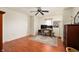 Office space with hardwood floors, light colored walls, ceiling fan and a multi-monitor workstation at 9915 Wellsford Cir, Indianapolis, IN 46236