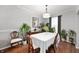 Formal dining room with hardwood floors, neutral paint, and elegant decor at 9915 Wellsford Cir, Indianapolis, IN 46236