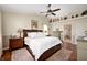 Cozy main bedroom featuring a ceiling fan, neutral decor, and private bathroom at 9915 Wellsford Cir, Indianapolis, IN 46236