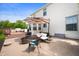 Back patio with comfortable seating and umbrella, perfect for outdoor relaxation and entertainment at 9915 Wellsford Cir, Indianapolis, IN 46236