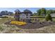 Beautiful community entrance sign displays 'Cedar Ridge' with flowers and professional landscaping at 1018 Cyprian Way, Lebanon, IN 46052