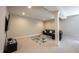 Basement area featuring a neutral carpet and dark leather couch, with a cozy and inviting atmosphere at 10291 Normandy Way, Fishers, IN 46040