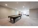 Finished basement featuring a billiards table, neutral walls and carpet, and ample lighting at 10291 Normandy Way, Fishers, IN 46040