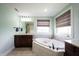Bright bathroom featuring a soaking tub, granite counters, and modern fixtures at 10291 Normandy Way, Fishers, IN 46040