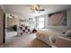 Bright bedroom boasts lots of natural light and carpeted floors at 10291 Normandy Way, Fishers, IN 46040