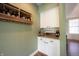 Charming butler's pantry features ample storage with wine rack, upper and lower cabinets, and granite countertops at 10291 Normandy Way, Fishers, IN 46040
