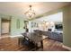 Casual dining area with wood floors and an open view to the inviting living room at 10291 Normandy Way, Fishers, IN 46040
