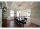 Formal dining area with ample natural light, wood floors, and elegant wainscoting at 10291 Normandy Way, Fishers, IN 46040