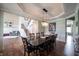 The dining room features hardwood floors and an adjacent living area with a staircase at 10291 Normandy Way, Fishers, IN 46040