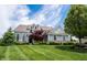 Beautiful two-story home boasting manicured lawn, blue siding, and stone accents at 10291 Normandy Way, Fishers, IN 46040