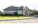 Charming amenity center featuring stone and wood accents, well-maintained landscaping, and convenient parking at 10291 Normandy Way, Fishers, IN 46040
