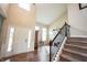Welcoming foyer features hardwood floors, staircase, and high ceilings at 10291 Normandy Way, Fishers, IN 46040