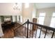 Open-concept foyer with staircase, dining area, and chandelier lighting at 10291 Normandy Way, Fishers, IN 46040