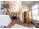 Elegant foyer showcasing hardwood floors, staircase, and open layout to dining at 10291 Normandy Way, Fishers, IN 46040