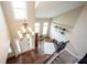 Bright foyer showcasing hardwood floors, chandelier, and staircase at 10291 Normandy Way, Fishers, IN 46040