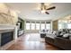 Inviting living room featuring a cozy fireplace, large windows, and plush seating at 10291 Normandy Way, Fishers, IN 46040