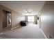 Spacious carpeted living room with fan, guitar, and lots of natural light at 10291 Normandy Way, Fishers, IN 46040