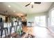 Spacious living area with hardwood flooring, kitchen bar, and lots of natural light at 10291 Normandy Way, Fishers, IN 46040