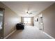 Cozy living room featuring neutral walls, plush carpeting, and a comfortable sofa by a bright window at 10291 Normandy Way, Fishers, IN 46040