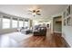 Open concept living room with a sectional sofa and access to the kitchen at 10291 Normandy Way, Fishers, IN 46040