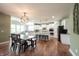 Open-concept living space with dining area and modern kitchen, perfect for entertaining at 10291 Normandy Way, Fishers, IN 46040