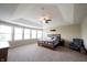Spacious main bedroom with tray ceilings, carpeting, and natural light at 10291 Normandy Way, Fishers, IN 46040