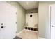 Bright mudroom with white hall tree and storage space near the front door at 10291 Normandy Way, Fishers, IN 46040