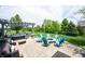 Backyard patio featuring a fire pit, Adirondack chairs, a seating area, and a pergola covered hot tub at 10291 Normandy Way, Fishers, IN 46040