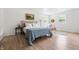 Bright bedroom features hardwood floors, two windows, a neutral color palette, and is tastefully decorated at 10429 Lasalle Rd, Carmel, IN 46033