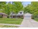 Charming two-story home with a brick facade, a covered front porch, and a well-maintained lawn at 10429 Lasalle Rd, Carmel, IN 46033