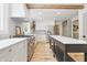 Spacious kitchen with wood floors, stainless appliances, and island with quartz countertops at 10429 Lasalle Rd, Carmel, IN 46033