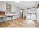 Bright laundry room features front load washer and dryer, folding table, and lots of storage cabinets at 10429 Lasalle Rd, Carmel, IN 46033
