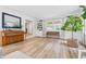Inviting living room showcases wood floors, built-in shelving, and natural light at 10429 Lasalle Rd, Carmel, IN 46033