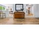 View from living room to kitchen shows wood floors and open concept design at 10429 Lasalle Rd, Carmel, IN 46033