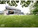 Expansive backyard with an in-ground pool, large patio, and lush green lawn perfect for outdoor living at 1050 Windsor Estates Ct, Westfield, IN 46074