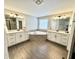 Luxurious bathroom featuring dual vanities, a corner tub, and stylish tile flooring at 1050 Windsor Estates Ct, Westfield, IN 46074