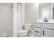 Clean bathroom featuring toilet, shower with curtain, and vanity with neutral color palette at 1050 Windsor Estates Ct, Westfield, IN 46074