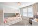 Cozy bedroom with a bunk bed, comfortable seating, and natural light at 1050 Windsor Estates Ct, Westfield, IN 46074