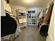 Well-organized walk-in closet with shelving and hanging space for optimal storage at 1050 Windsor Estates Ct, Westfield, IN 46074